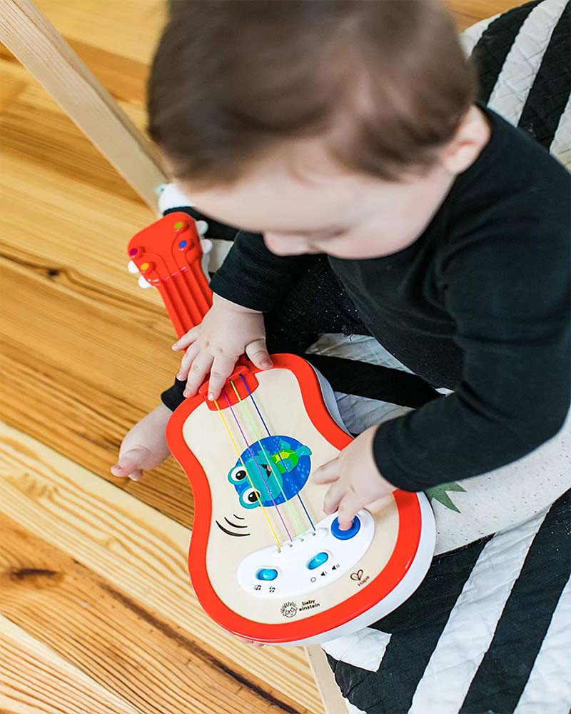 Ukulele instrument with a magic touch toy for kids